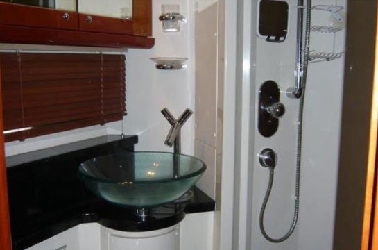Modern interior bathroom and shower inside the Hibiki Sunseeker 60 yacht charter.