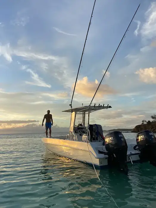 Juguetita Twin Vee 26 foot private boat charter anchored near a beach in Puerto Rico.