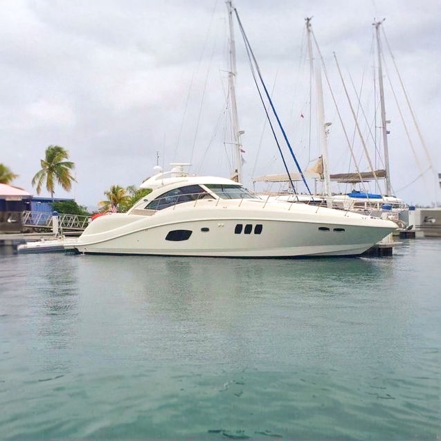 Sea Ray 55 foot luxury yacht charter anchored in clear waters of Puerto Rico.