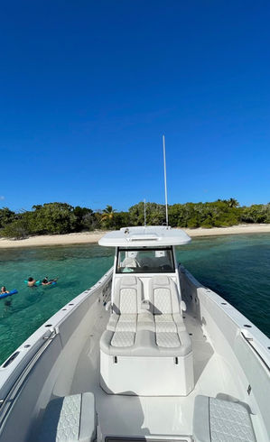 Front view of the Sea Fox 36 private charter boat navigating the Caribbean Sea.