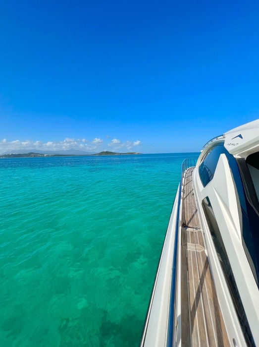 Azimut 60 foot luxury yacht charter sailing in clear waters of Puerto Rico.