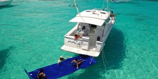 Aft view of the Palomino Tiara 40 private boat charter with a floating mat attached.