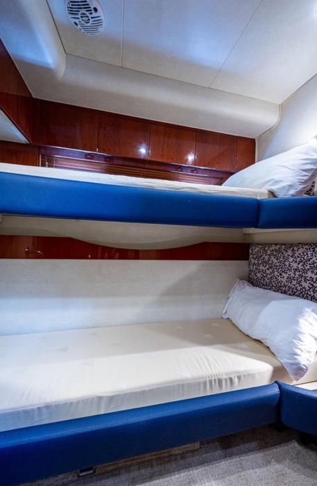 Guest cabin with bunk beds on the Dakiti 60 overnight yacht rental in Puerto Rico.