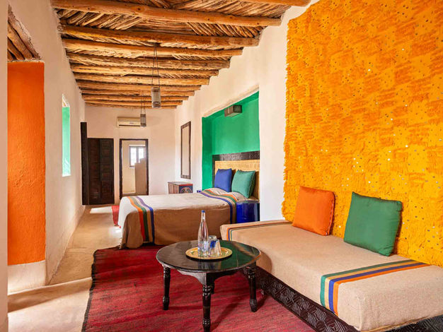 Comfortable guest Berber Room with traditional Moroccan design at Tigmi hotel in Marrakech.