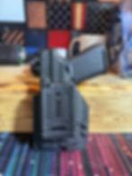 Unedited back image of a owb holster for the glock 19 gen 5 with olight baldr s that is optic ready