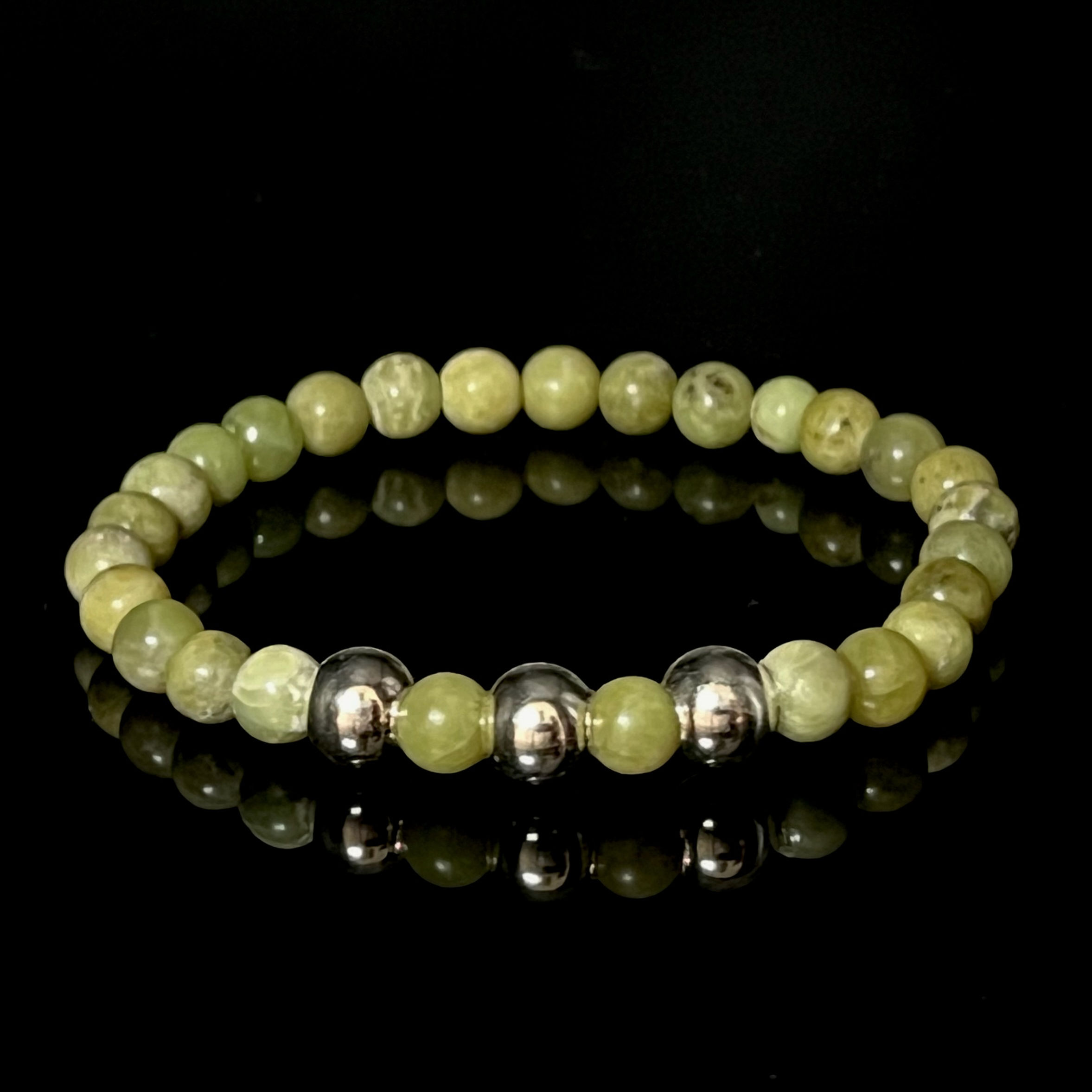 Peridoot rond 6mm en Sterling Zilver spacers