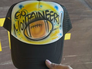 Live Airbrush Hats at a West Virginia–Colorado Football Event