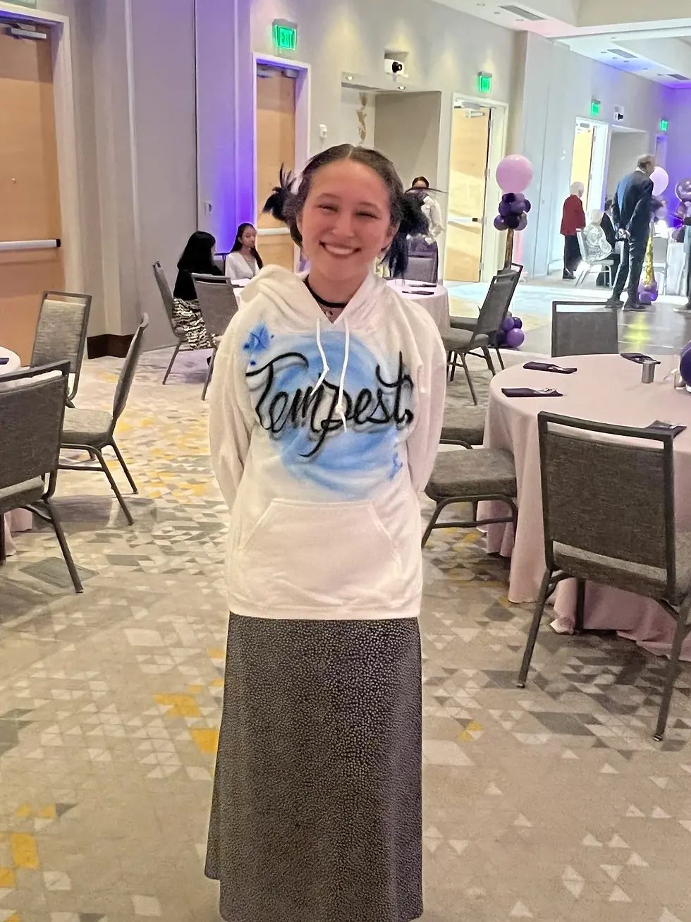 Guest displaying a blue personalized airbrushed hoodie at an event in Portland, Oregon