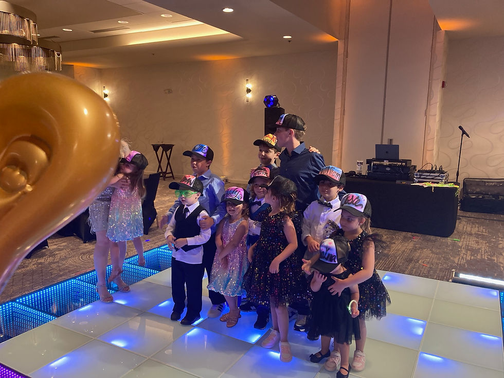 Young guests wearing personalized trucker hats at an Asheville bar mitzvah