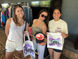 Guests display personalized airbrush tote bags and a trucker hat at the University of Tennessee event in Knoxville.