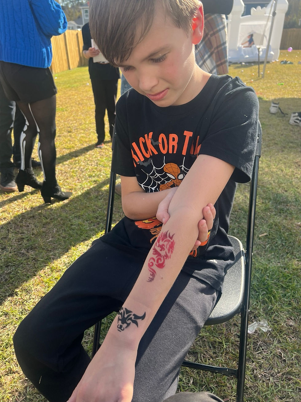 Guest showing a temporary arm tattoo in Austin, Texas