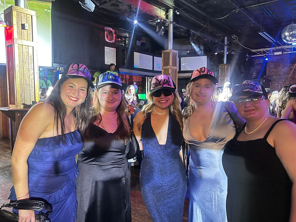 Friends wearing custom hats at a University of South Carolina Delta Gamma event