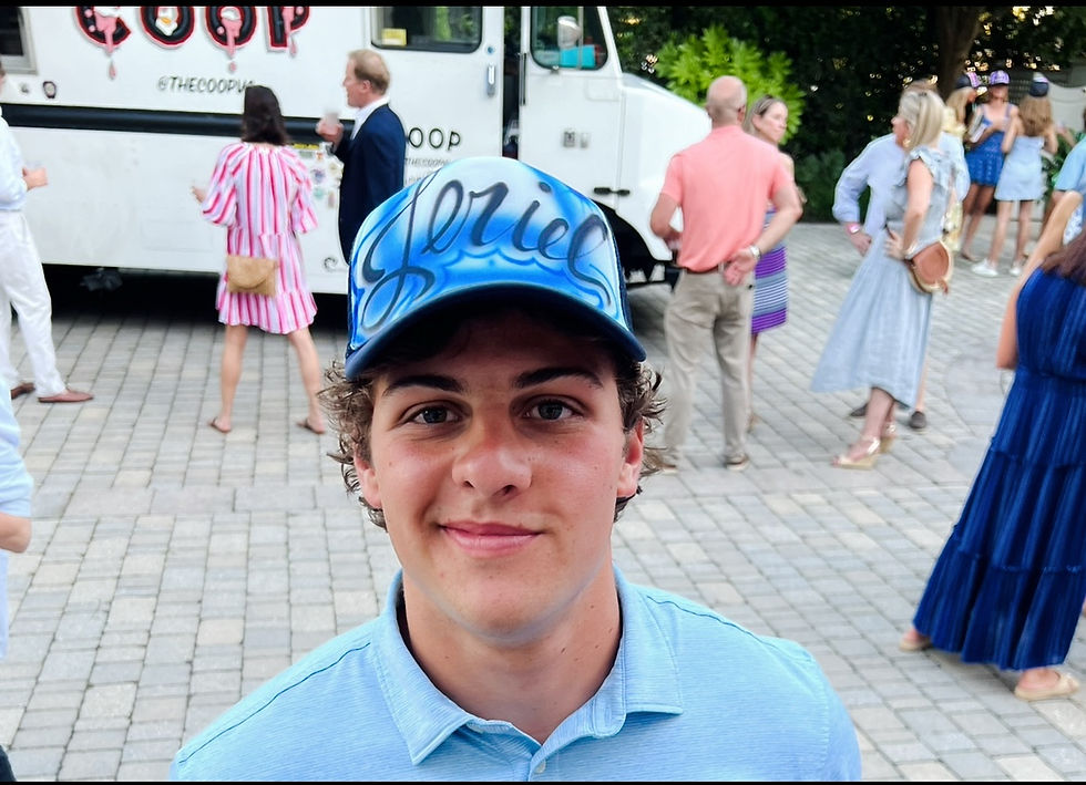 Guest wearing a blue personalized Charlie airbrushed hat at a Virginia Beach party