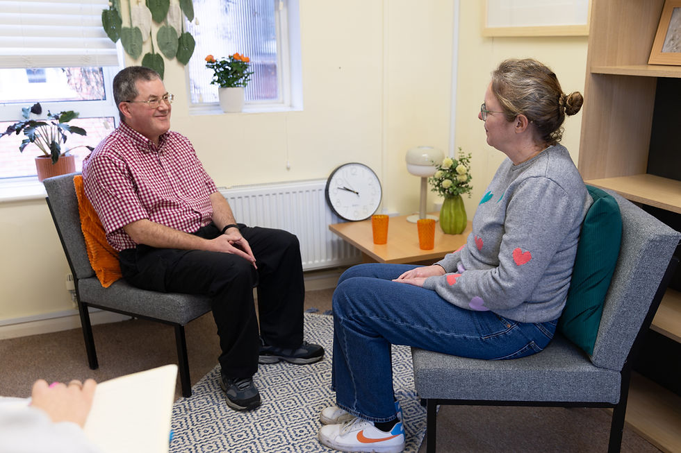 Man and woman in a therapeutic counselling session