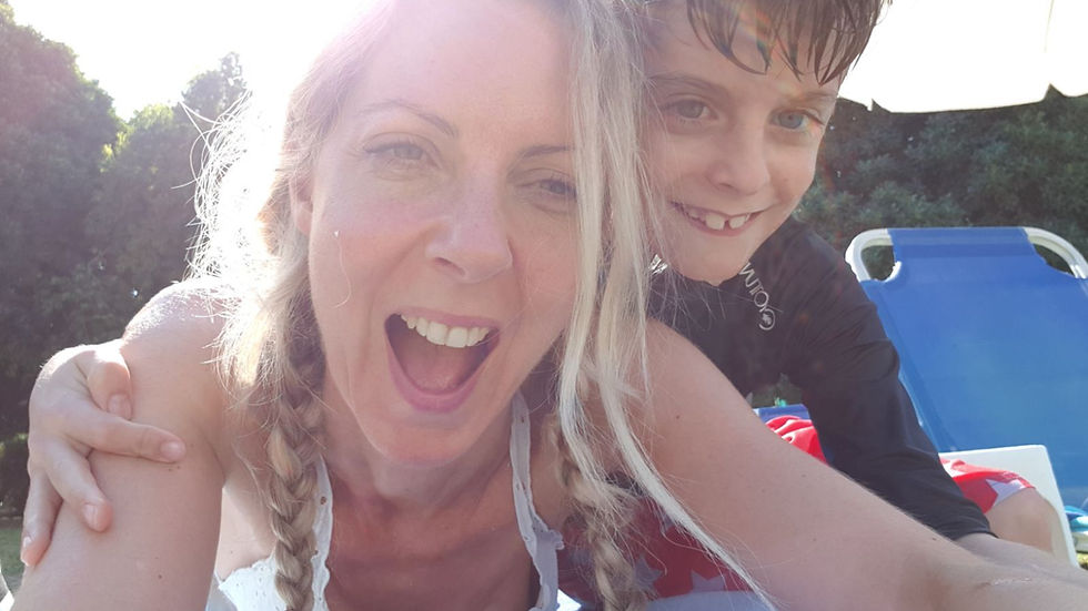 Victoria laughing with a joyful child