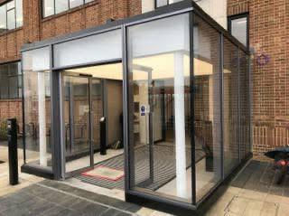 Modern glass entrance of a commercial building