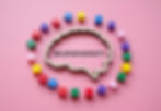 Brain cutout with NEURODIVERSITY text and colorful blocks