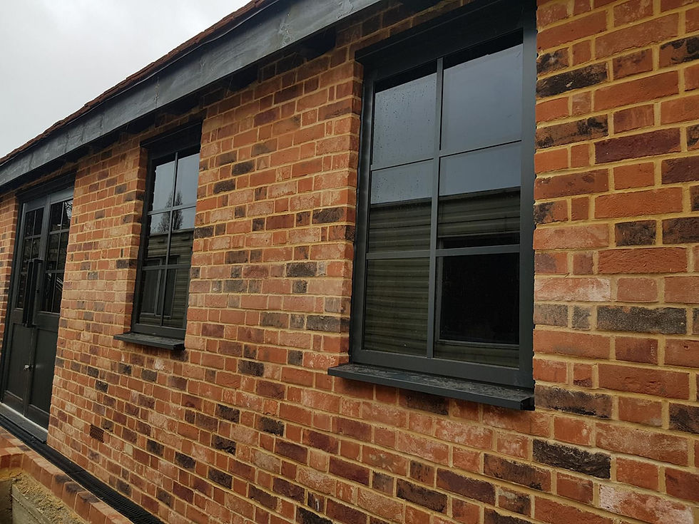 Brick building with dark-framed windows