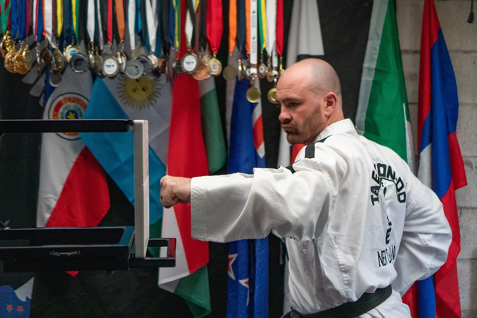 Taekwondo World Champion Brendan Doogan practicing power breaking using reusable PNP Breaker Boards