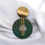 Miniature : Boucles d'oreilles aux pigments verts et dorés