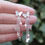 Thumbnail: Long silver butterfly and pearl earrings
