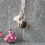 Thumbnail: Dainty silver charm necklace with silver flower and black cubic zirconia