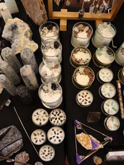 selection of crystal candles on market stall