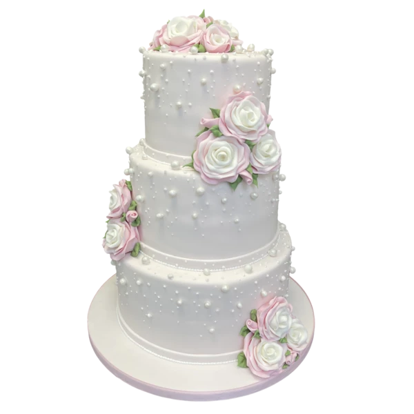 Three-tiered white wedding cake with pink and white sugar paste roses and pearl details.