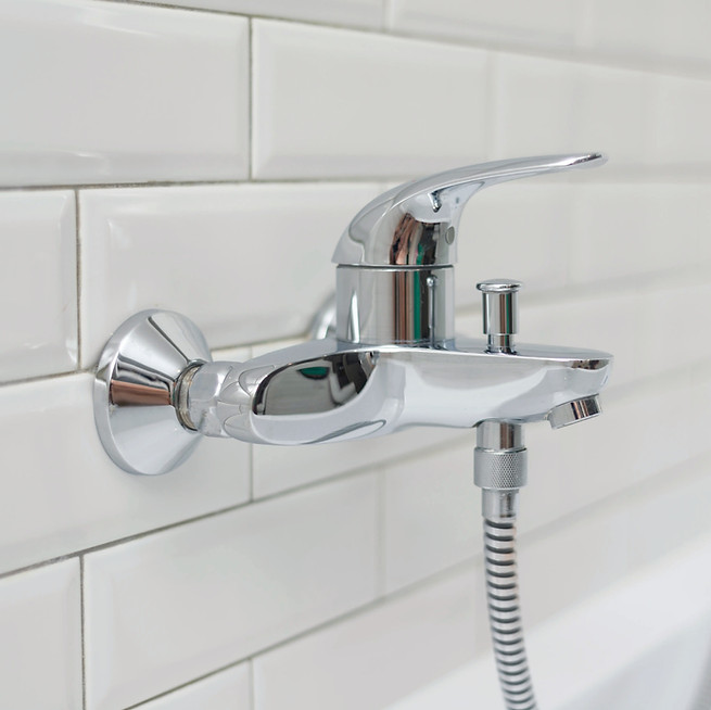 Close-up of bathroom faucet installation — plumbing repair and fixture replacement