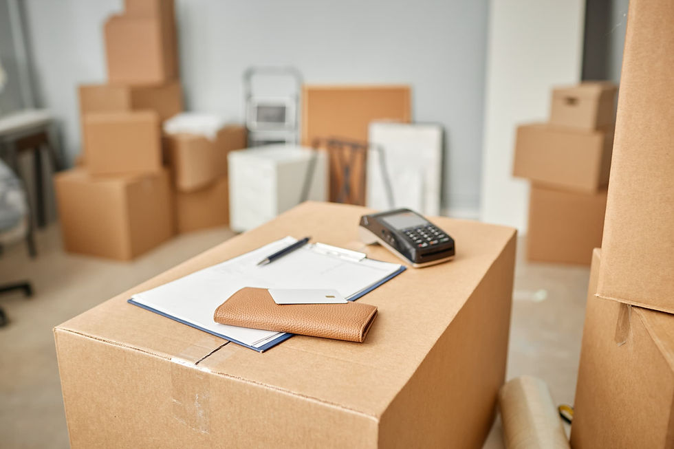 Moving boxes and calculator used to estimate long-distance moving costs