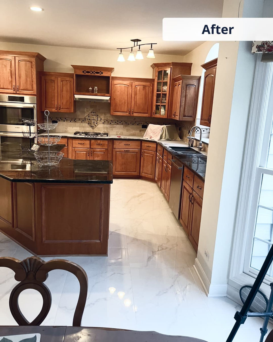 Kitchen after renovation — polished countertops and fresh flooring
