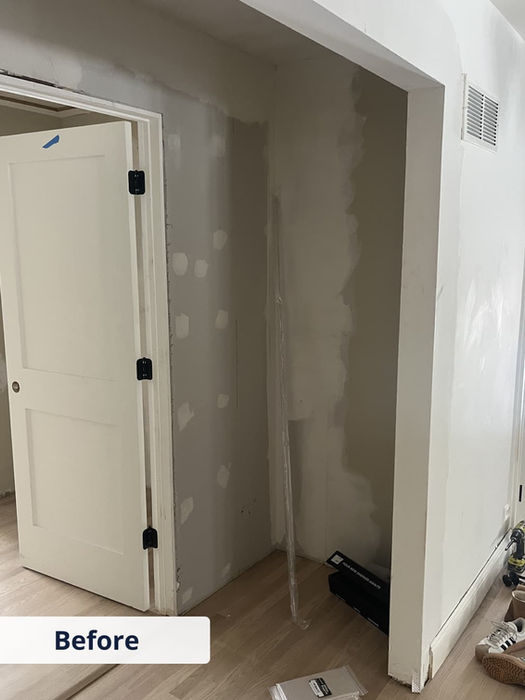 Empty hallway closet before custom shelving installation