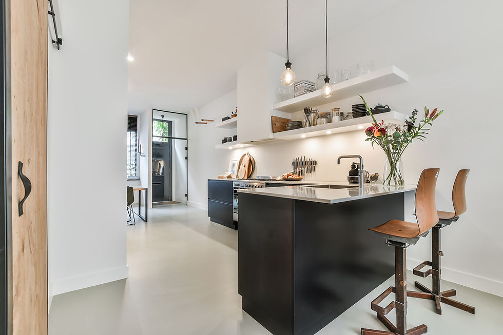 Minimalist black and white kitchen with open shelves and pendant lights