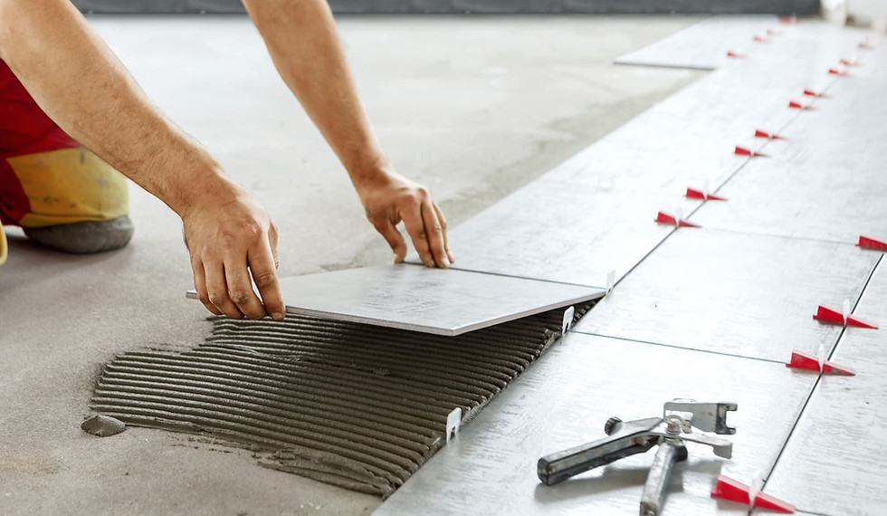 Professional tile installation on a floor with spacers for clean alignment and lasting results