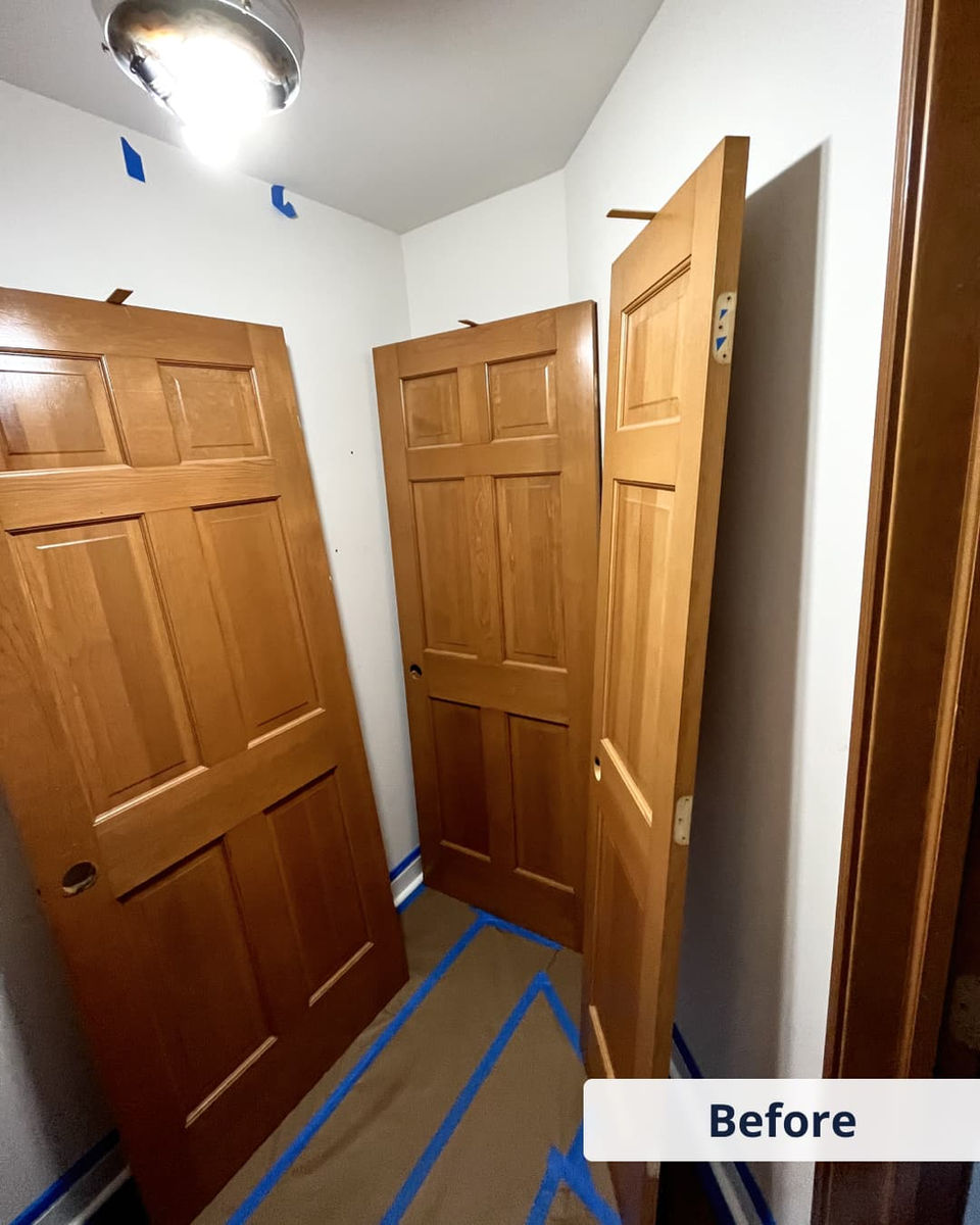 Interior wooden doors before painting — original finish with no paint or prep work.