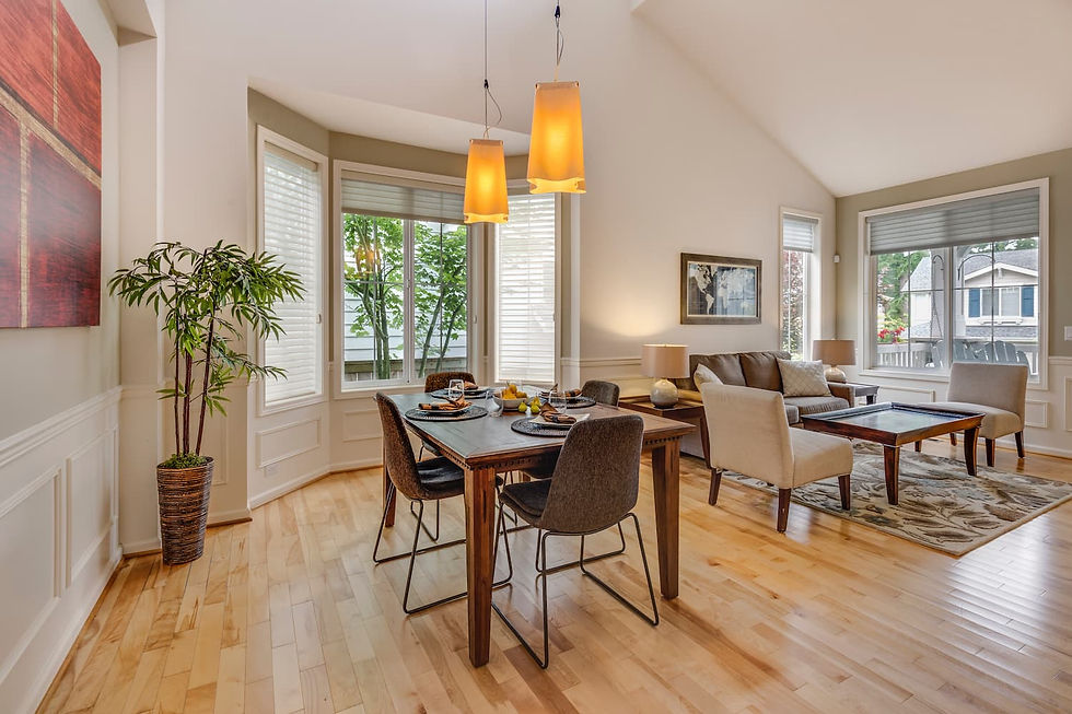 Modern living room with dining area showing results of professional home improvement project