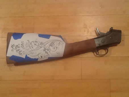 Wire inlays in a gun stock.