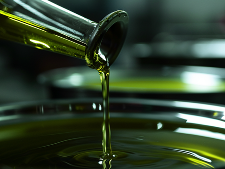 Freshly extracted Antalya Olive Ranch extra virgin olive oil flowing from the mill, showcasing our deep green, early-harvest quality