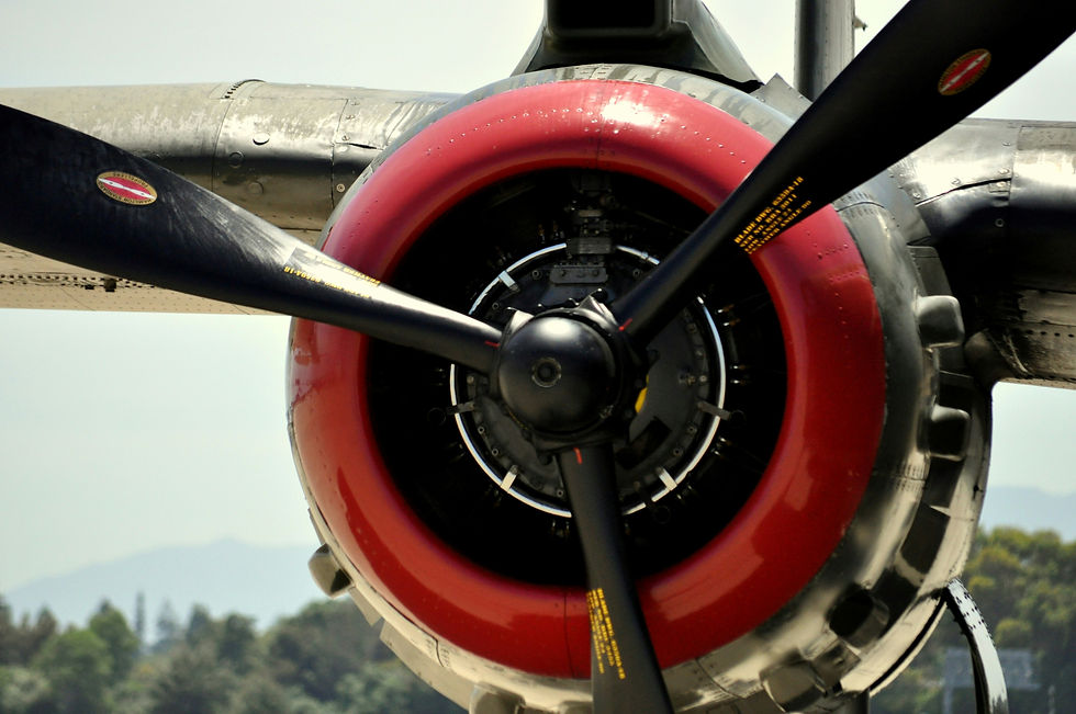 Closeup of airplane engine, including prop.