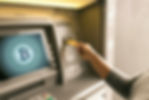 close-up-woman-inserting-card-atm-machine_edited_edited.jpg