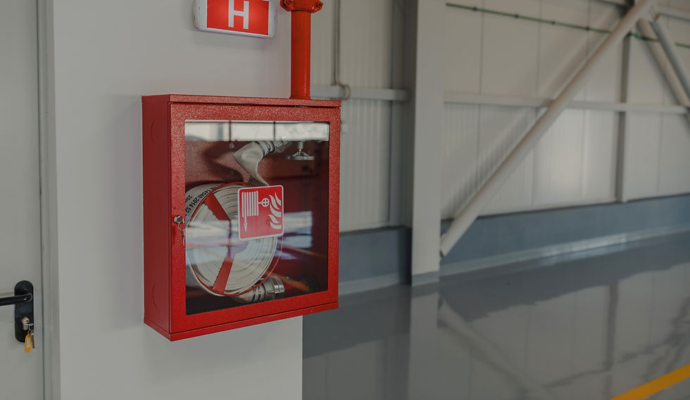 Fire hose in a cabinet in an industrial setting