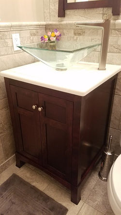 Amazing tile work and vanity in a Powder Room