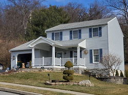 On top of adding the porch rand porch roof, we installed stone around the foundation takin