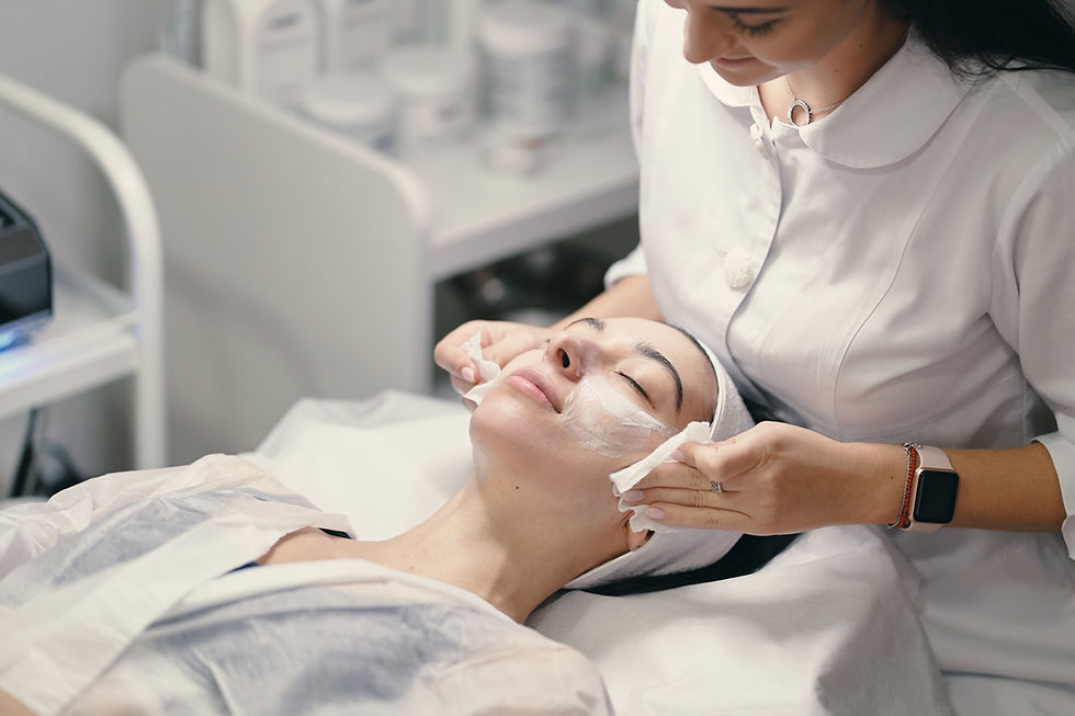 female-cosmetologist-making-facial-treatment-beautiful-woma.jpg