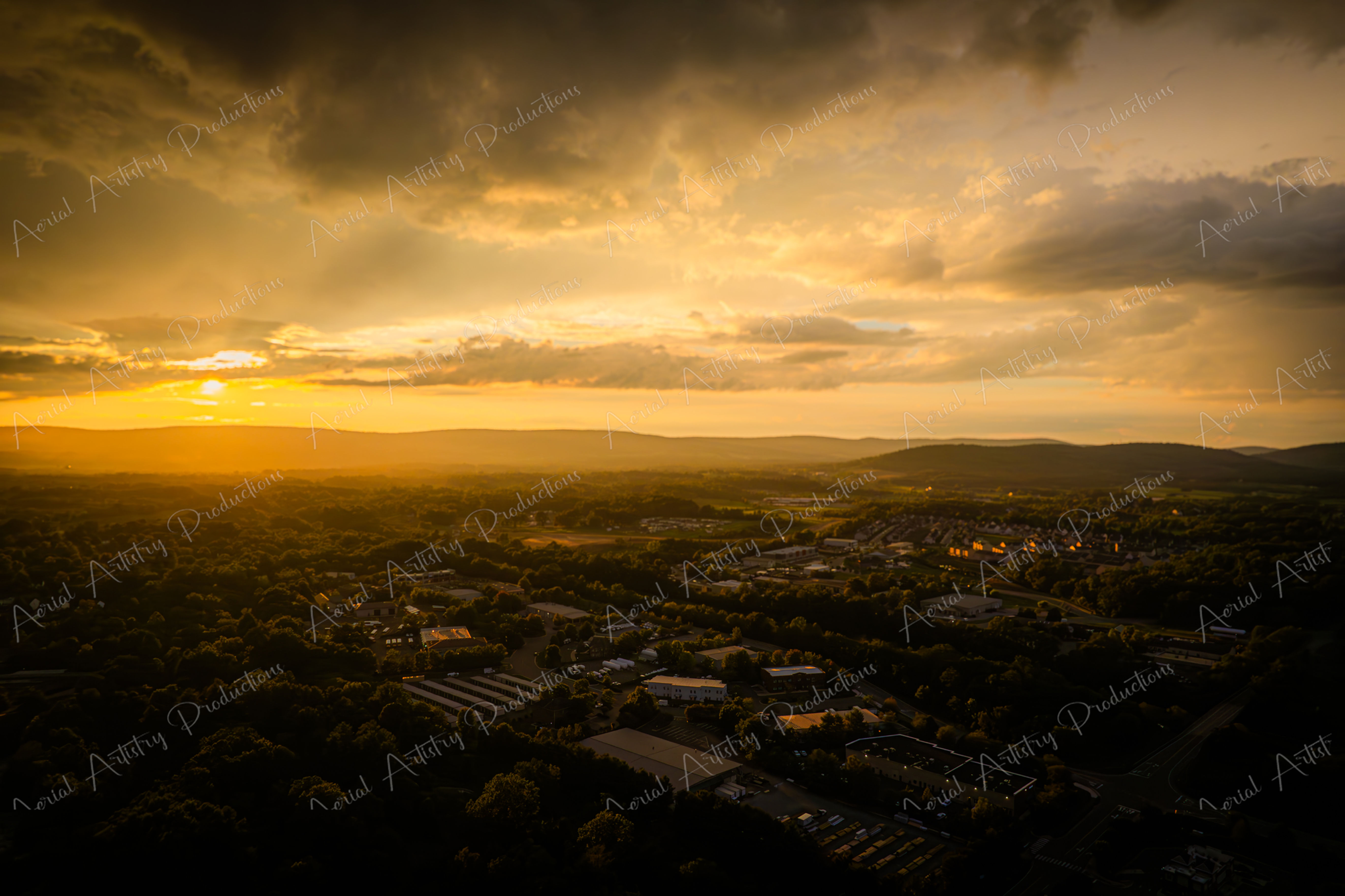 Golden Hour Sunset Over Urban and Rural Landscape