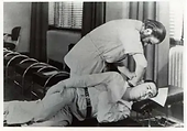 Vintage black and white photo of a chiropractor adjusting a patient in the early days of chiropractic