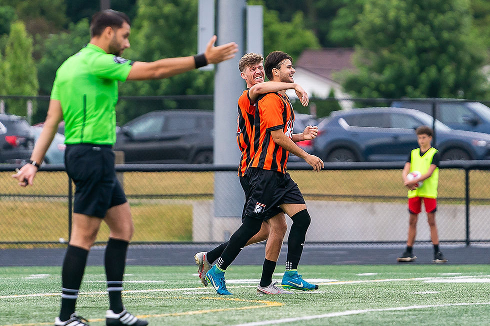 Alexandru Rumleanschi and Jordan Lewis celebrate