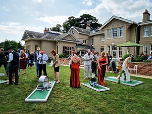 Wedding guests playing mini-golf at a yorkshire wedding