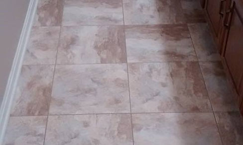 luxury vinyl tile, with pre mixed grout 15" x 15" installed by Eleet Flooring