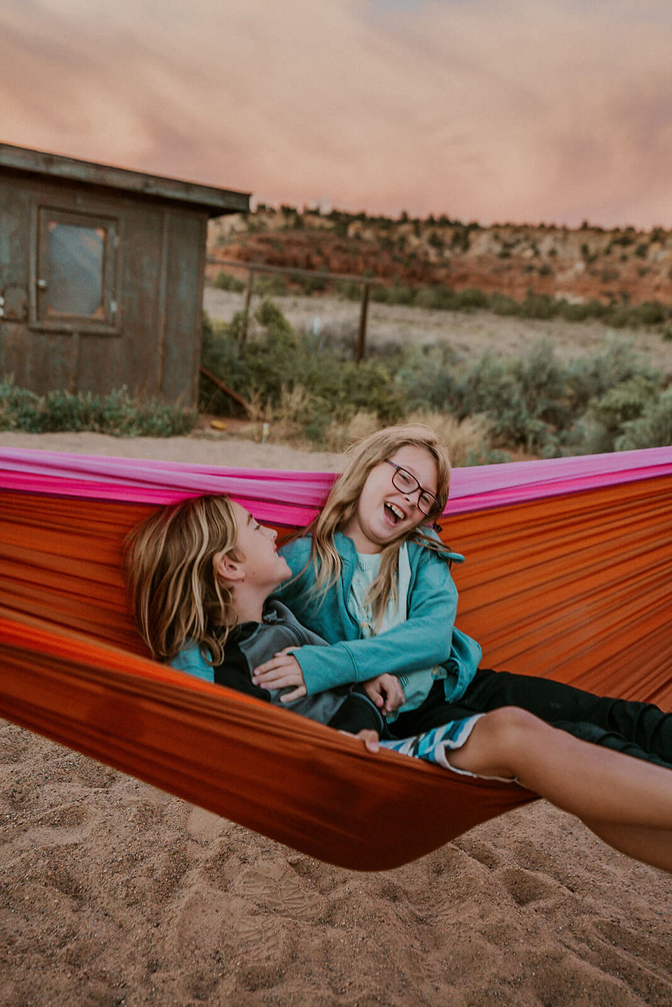 Kids playing in hammock BaseCamp37 glamping property outside Zion National Park